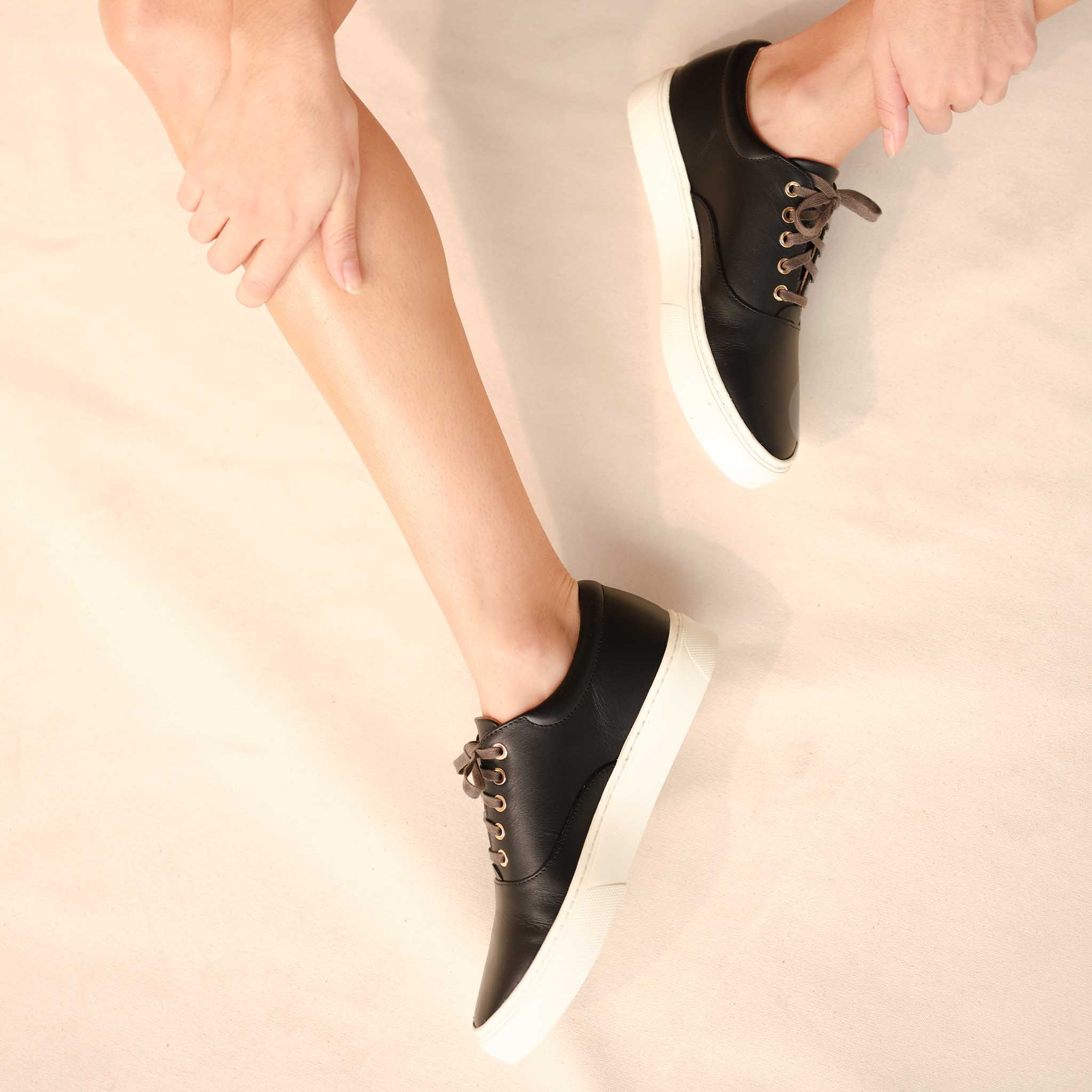 Image 2 of the Everyday Sneaker Black on model